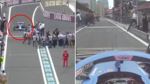 Esteban Ocon narrowly avoids disaster with media personnel in the pit lane