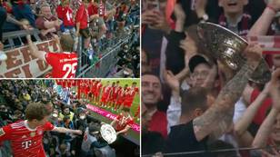 Thomas Muller Climbs Into Stands To Allow Bayern Munich Fans To Take Bundesliga Trophy