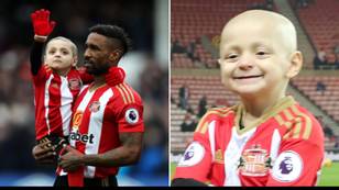 Man charged after picture of Bradley Lowery was held up at match