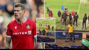 James McClean had to be held back by Wrexham players during heated altercation with Mansfield fan