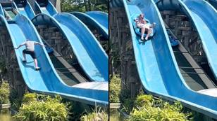 Heroic dad climbs halfway up water slide after daughter gets stuck