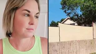 Woman claims neighbours got 'so sick' of seeing her swimming in back garden they put up a 'huge wall'