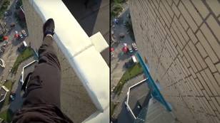 Parkour runner misses his jump and falls off a high rise rooftop