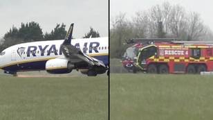 Sparks fly from Ryanair plane after its nose wheel collapsed while landing