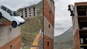 Stuntman cheats death when car jump from building rooftop goes horribly wrong