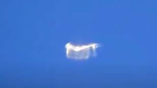 Plane Passenger Films 'Shape-Shifting UFO' Hovering 'Thousands Of Feet Above Earth'