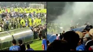 At least 125 football fans dead after massive riot breaks out at match