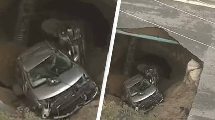 Sinkhole opens in California swallowing two cars after torrential rain