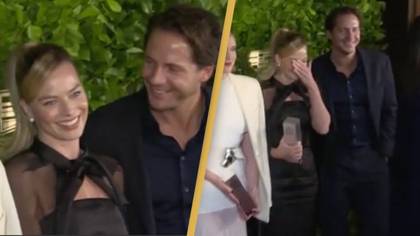 Reporter catches Margot Robbie and husband 'doing NSFW act' on red carpet