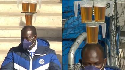 German Football Fan Hailed As A Hero For Somehow Balancing Three Beers And A Phone On His Head