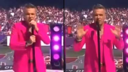 Robbie Williams stops midway through new song to reassure audience he’ll sing the hits after