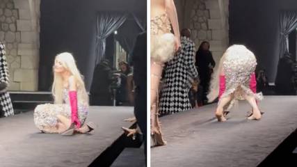 Shocking moment model can't walk in heels and falls over on runway
