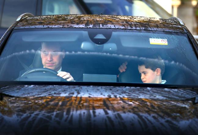 Prince William driving Prince George. Credit: Alamy / Gavin Rodgers 