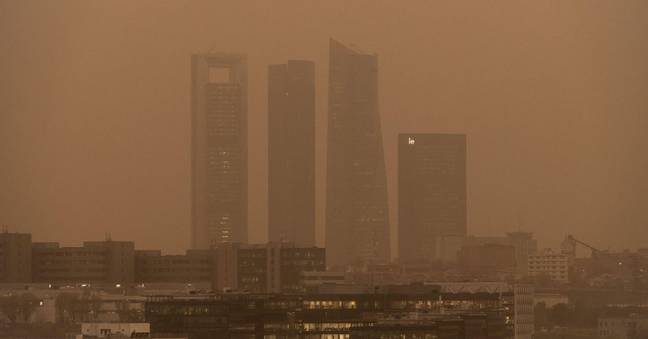 The city of Madrid was covered in an orange mist on Tuesday. (Credit: Alamy)