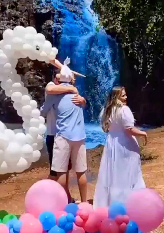 A couple have come under fire for dyeing a waterfall blue. Credit: CEN