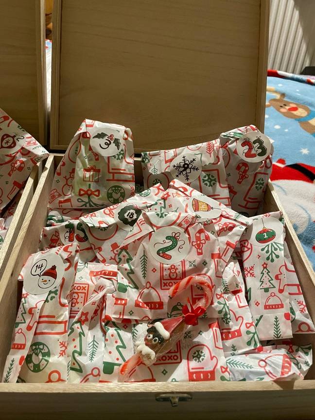The presents - one for each day of December - were individually wrapped by Karina. Credit: SWNS   