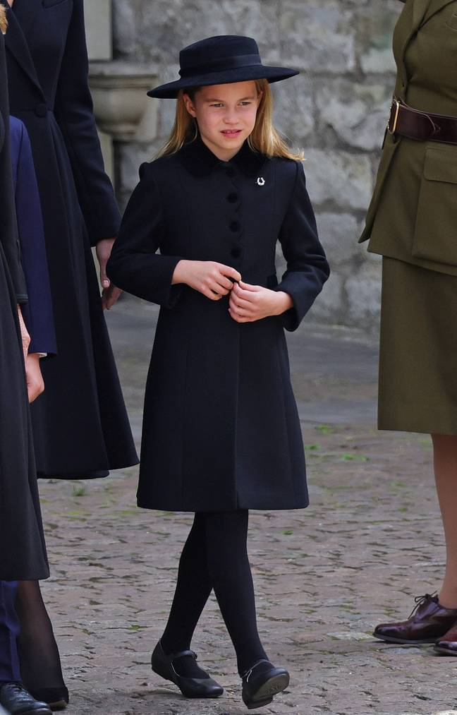 Princess Charlotte, seen wearing a horseshoe-shaped broach, walked behind the coffin with her family. Credit: Chris Jackson/Getty Images