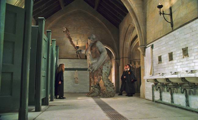 The Slytherins were ultimately safe as the troll didn't stay in the dungeons for long, instead making it's way to the girls bathroom (Credit: Warner Bros. Pictures)