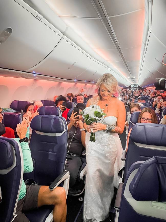The airline crew swapped out their usual duties for a spot of in-flight decorating, donning toilet paper streamers across the cabin (Southwest Airlines Facebook).