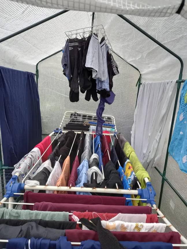 A mum has shared how she uses a plastic greenhouse to dry her family's washing. Credit: Facebook/Extreme Couponing and Bargains UK