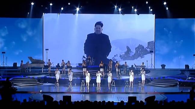 Singers sang at footage of Kim Jong-un standing in the snow. Credit: Reddit