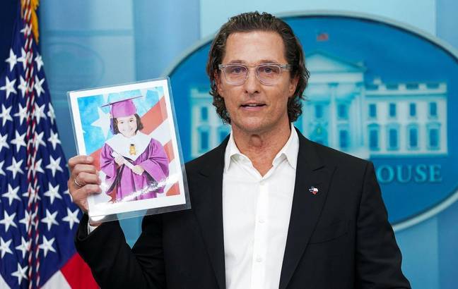 Actor Matthew McConaughey holds a picture of 10-year-old school shooting victim Alithia Ramirez. Credit: Alamy