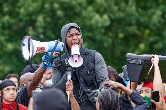 John Boyega seen giving a speech as protesters attend a Black Lives Matter Protest in Hyde Park London over the death of George Floyd. Credit: Alamy