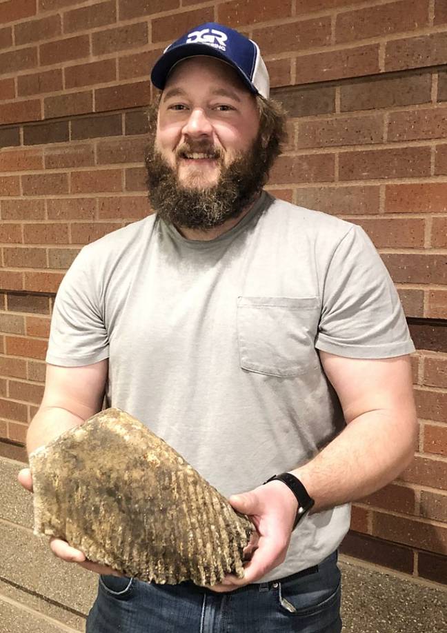 Justin Blauwet discovers woolly mammoth tooth. Credit: DGR Engineering