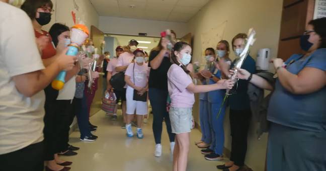 10-year-old Mayah Zamora handed out roses to hospital staff as she left. Credit: University Health