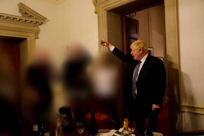 Johnson was pictured raising a toast at a party during lockdown. Credit: Sue Gray Report