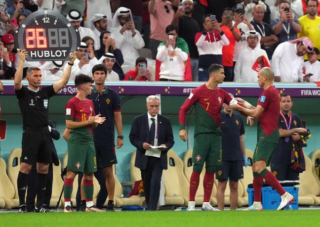 Pepe puts the captain's armband on Ronaldo as he comes on. Image: Alamy
