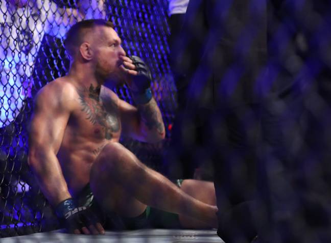 Conor McGregor receives medical attention at UFC 264. Image: Alamy 