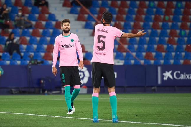 Pique and Busquets are being asked to take pay cuts again. Image: Alamy