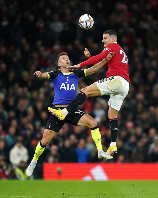 Diogo Dalot challenges Ivan Perisic in the air at Old Trafford. (Alamy)