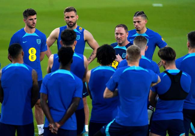 England players receiving instructions from assistant manager Steve Holland in Qatar. (Image Credit: Alamy)
