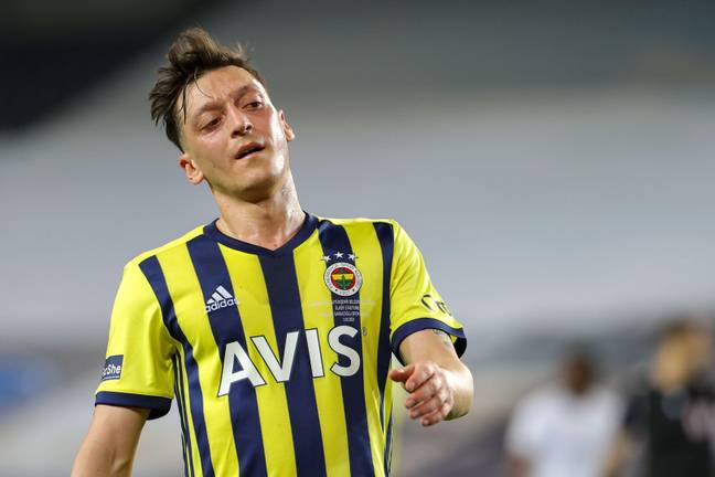Ozil is currently suspended by Fenerbahce (Image: PA)