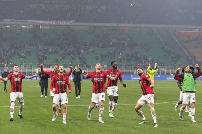 Milan players celebrate their win over Inter that meant they had the advantage in the title race. Image: Alamy