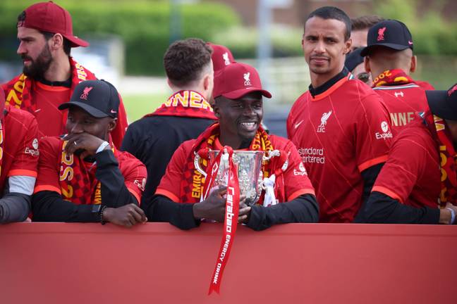  Liverpool's Sadio Mane holding the Carabao Cup trophy with Naby Keita and Joel Matip during the bus parade. Credit: Alamy