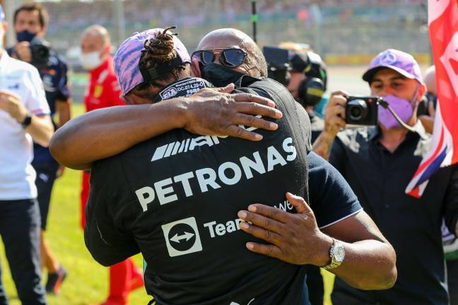 Hamilton hugs dad Anthony, something he hasn't always been able to do. Image: Alamy
