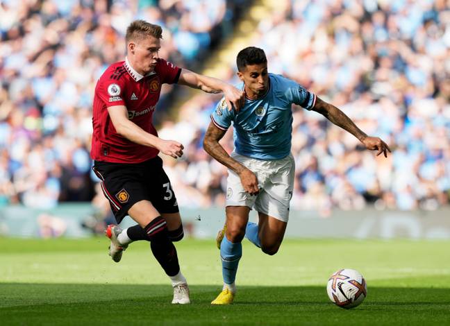 Scott McTominay and Joao Cancelo battle for the ball. (Image Credit: Alamy)