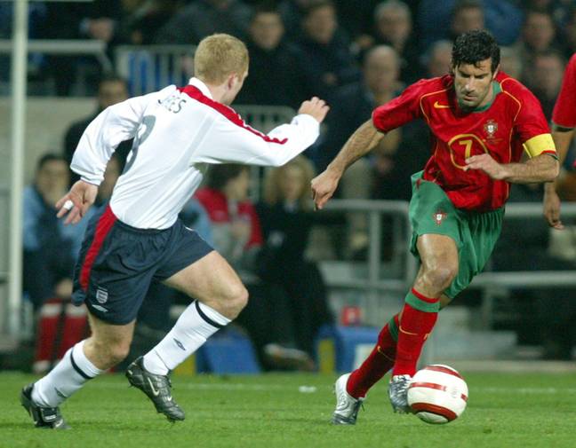 Luis Figo and Paul Scholes battle it out while on international duty in Feburary 2004. (Alamy)