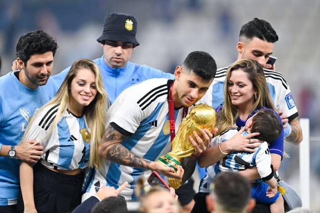 Romero celebrates with the trophy. Image: Alamy
