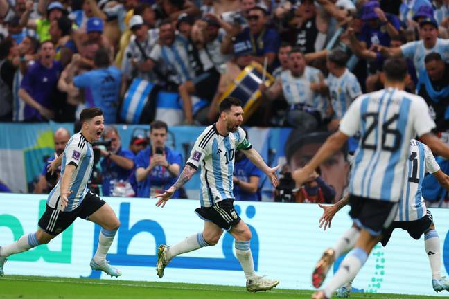 Lionel Messi wheels away in celebration. Image: Alamy 