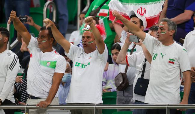Iran fans boo the anthem that the players were forced to sing. Image: Alamy