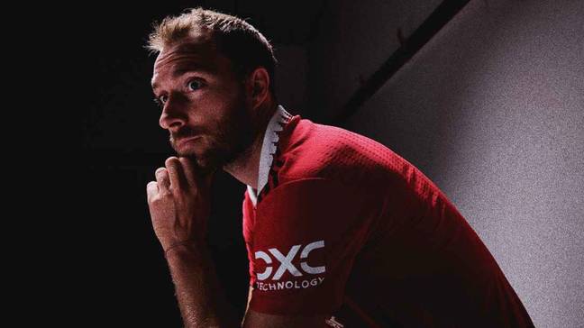 Christian Eriksen poses in the Manchester United home shirt. (Man Utd)
