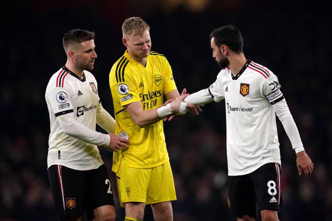 Luke Shaw and Bruno Fernandes in conversation with Arsenal goalkeeper Aaron Ramsdale. (Image Credit: Alamy)