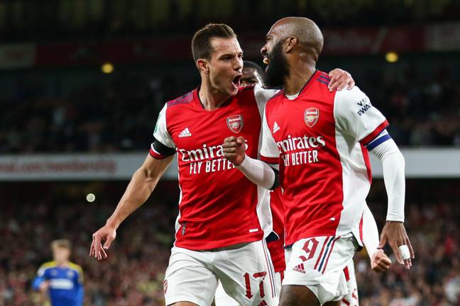 Lacazette and Cedric during a game last season. (Image Credit: Alamy)