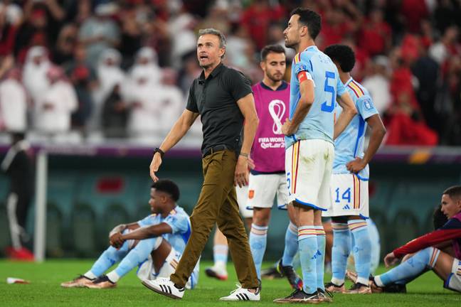 Luis Enrique and the Spain players look on dejected after the loss to Morocco. Image: Alamy