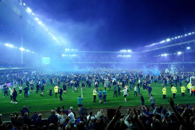 Everton fans flood the pitch at full time. Image: PA Images