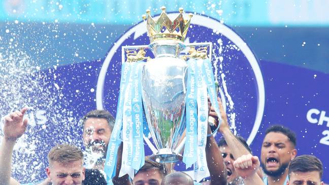 Manchester City lift the Premier League trophy for 2021/22.